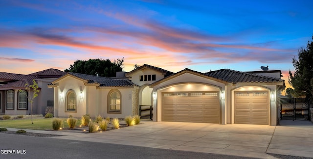 737 Al Smith Ln, El Paso, TX 79932 - mediterranean / spanish home featuring a garage, stucco siding, concrete driveway, and a tiled roof