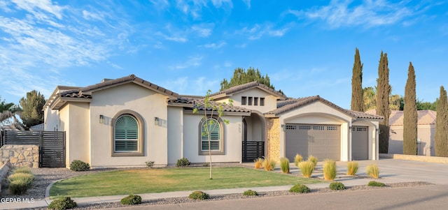 737 Al Smith Ln, El Paso, TX 79932 - mediterranean / spanish-style home with a garage, driveway, stucco siding, and a tile roof