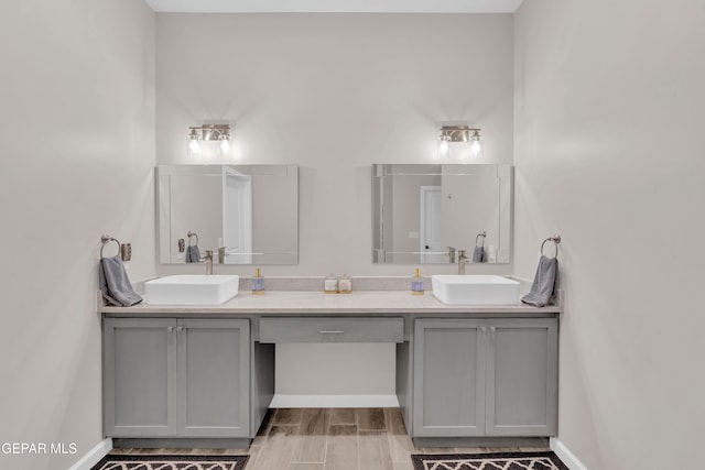 737 Al Smith Ln, El Paso, TX 79932 - bathroom featuring double vanity and wood finished floors