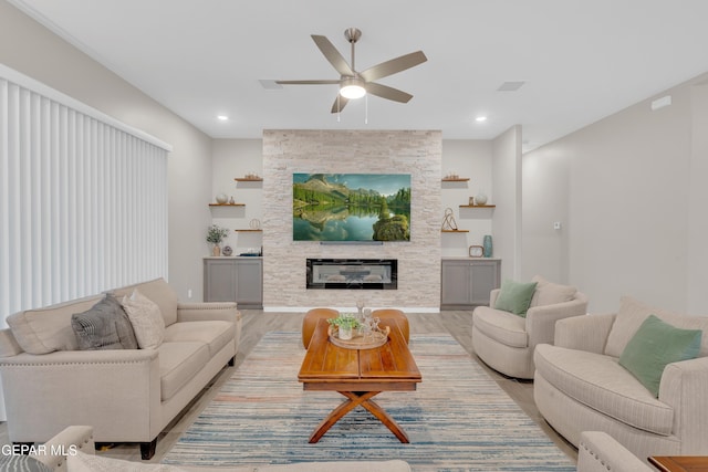 737 Al Smith Ln, El Paso, TX 79932 - living area with light wood-type flooring, ceiling fan, a fireplace, and recessed lighting