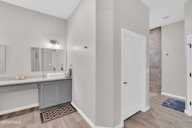 737 Al Smith Ln, El Paso, TX 79932 - full bath featuring vanity, walk in shower, and wood finished floors