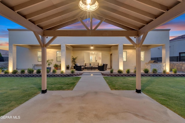 737 Al Smith Ln, El Paso, TX 79932 - patio terrace at dusk featuring a patio, outdoor lounge area, and a yard