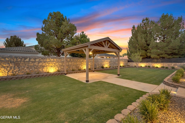 737 Al Smith Ln, El Paso, TX 79932 - yard at dusk with a patio area, a fenced backyard, and a gazebo