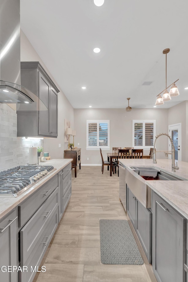 737 Al Smith Ln, El Paso, TX 79932 - kitchen featuring gray cabinetry, exhaust hood, appliances with stainless steel finishes, backsplash, and recessed lighting