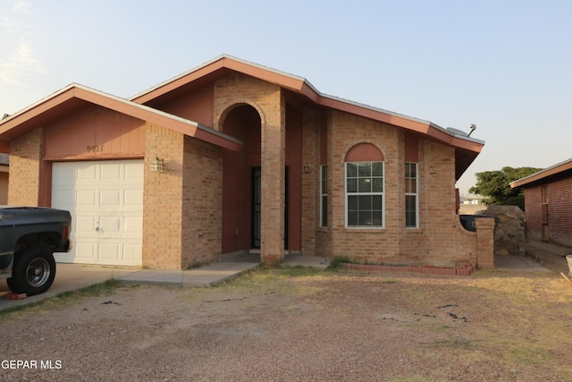 9421 Ariel Rico Ct, El Paso, TX 79907 - view of front of house with an attached garage, driveway, and brick siding