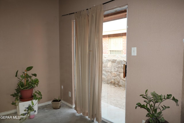 9421 Ariel Rico Ct, El Paso, TX 79907 - corridor featuring concrete floors and baseboards
