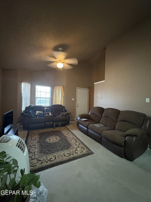 9421 Ariel Rico Ct, El Paso, TX 79907 - carpeted living room featuring a textured ceiling and a ceiling fan