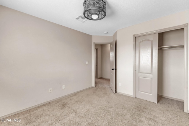 14330 Woods Point Ave, El Paso, TX 79938 - unfurnished bedroom with light colored carpet and a closet