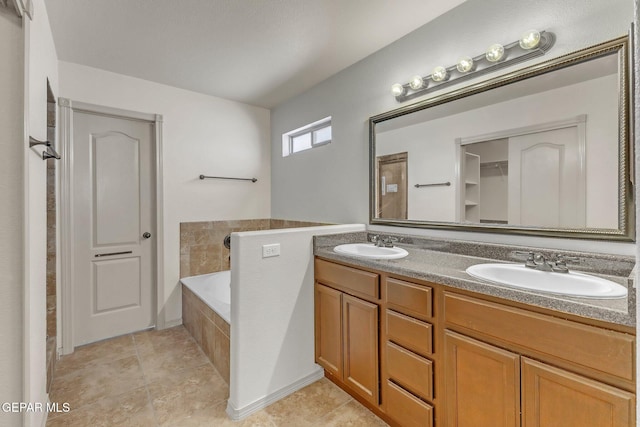 14330 Woods Point Ave, El Paso, TX 79938 - full bathroom with double vanity and a bath
