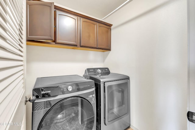 14330 Woods Point Ave, El Paso, TX 79938 - laundry area with independent washer and dryer and cabinet space