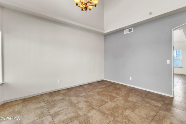 14330 Woods Point Ave, El Paso, TX 79938 - empty room with arched walkways, a chandelier, and a high ceiling