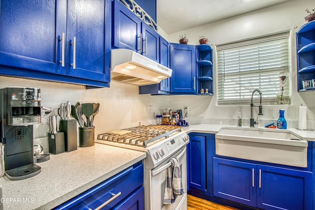 4327 Oxford Ave, El Paso, TX 79903 - kitchen featuring stainless steel gas stove, under cabinet range hood, and blue cabinets