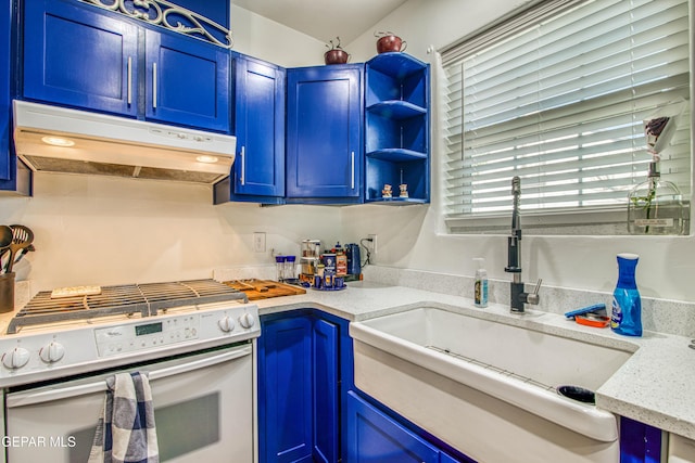 4327 Oxford Ave, El Paso, TX 79903 - kitchen featuring white stove, under cabinet range hood, blue cabinetry, light stone countertops, and open shelves