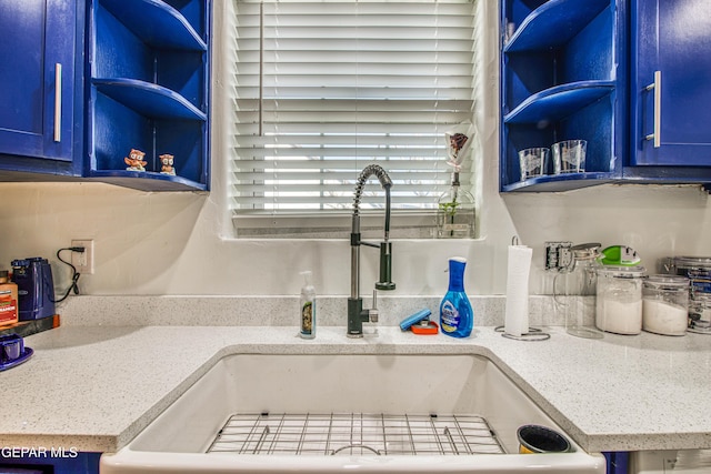 4327 Oxford Ave, El Paso, TX 79903 - kitchen view of blue cabinetry, open shelves, and light countertops