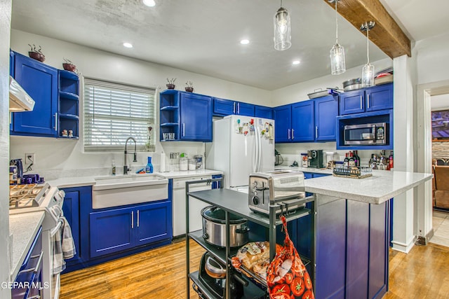 4327 Oxford Ave, El Paso, TX 79903 - kitchen featuring appliances with stainless steel finishes, open shelves, blue cabinetry, light wood-style flooring, and recessed lighting