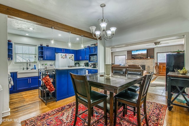 4327 Oxford Ave, El Paso, TX 79903 - dining room with light wood-style floors, a chandelier, beamed ceiling, and recessed lighting