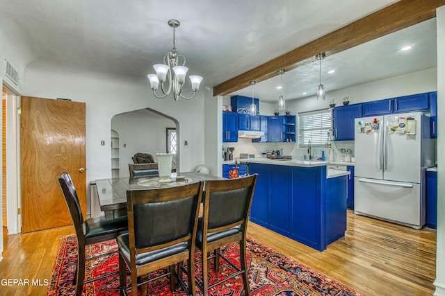 4327 Oxford Ave, El Paso, TX 79903 - dining space with beamed ceiling, arched walkways, light wood finished floors, a chandelier, and recessed lighting