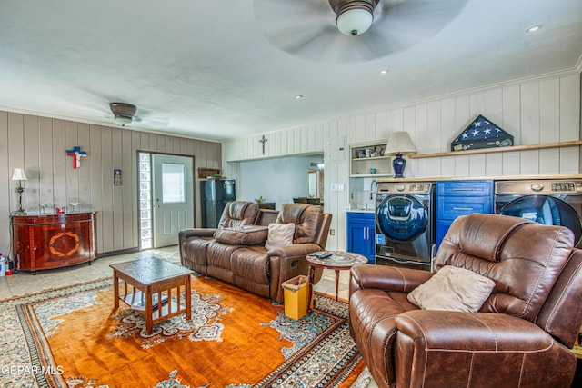 4327 Oxford Ave, El Paso, TX 79903 - living area featuring washer / dryer, a ceiling fan, wooden walls, and crown molding