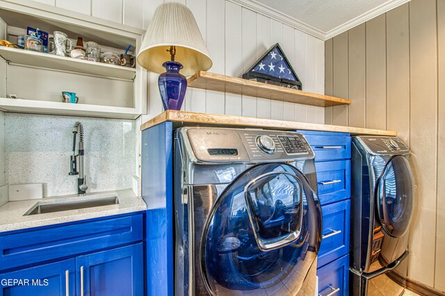 4327 Oxford Ave, El Paso, TX 79903 - laundry area featuring washer and dryer and ornamental molding