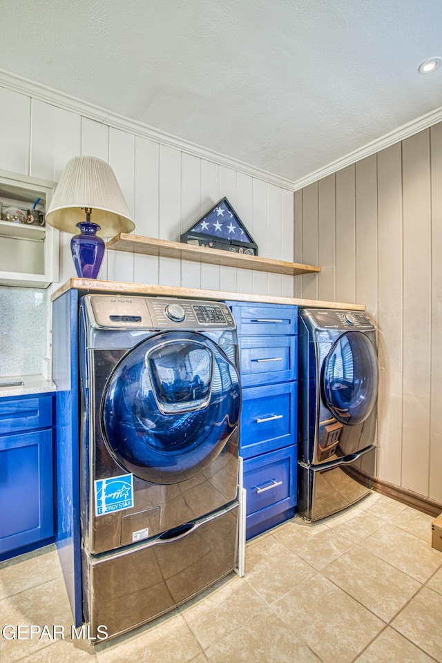 4327 Oxford Ave, El Paso, TX 79903 - laundry area featuring washer and clothes dryer, crown molding, light tile patterned flooring, and recessed lighting
