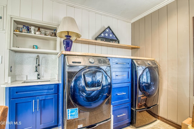4327 Oxford Ave, El Paso, TX 79903 - laundry area with crown molding, washing machine and clothes dryer, and wood walls