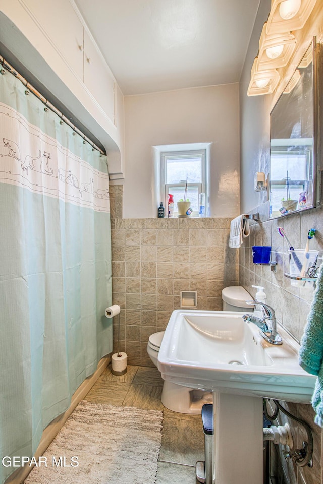 4327 Oxford Ave, El Paso, TX 79903 - full bathroom with tile walls, a shower with curtain, and tile patterned floors