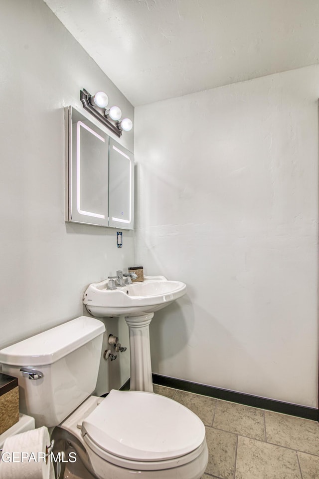 4327 Oxford Ave, El Paso, TX 79903 - half bathroom with toilet and baseboards