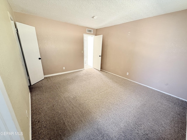 8429 Lasso Cir, El Paso, TX 79907 - carpeted spare room featuring baseboards and a textured ceiling