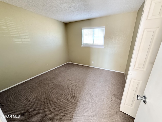 8429 Lasso Cir, El Paso, TX 79907 - empty room with carpet and a textured ceiling
