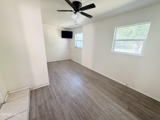 8429 Lasso Cir, El Paso, TX 79907 - spare room with wood finished floors and ceiling fan