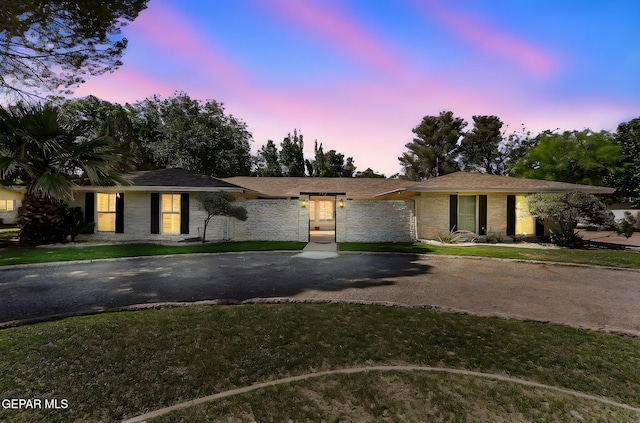 745 Rinconada Ln, El Paso, TX 79932 - ranch-style home with asphalt driveway and a front yard