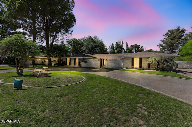 745 Rinconada Ln, El Paso, TX 79932 - single story home with curved driveway and a front lawn