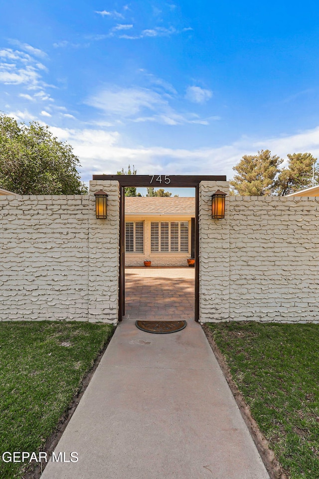 745 Rinconada Ln, El Paso, TX 79932 - gate with a fenced backyard and a patio