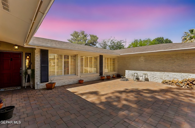 745 Rinconada Ln, El Paso, TX 79932 - patio terrace at dusk featuring a patio area