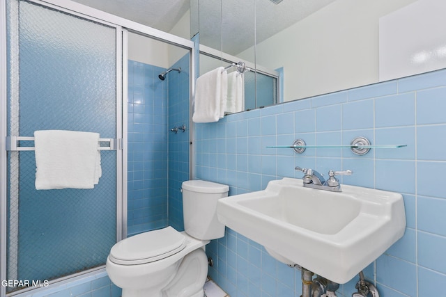 745 Rinconada Ln, El Paso, TX 79932 - full bathroom with tile walls and a shower stall