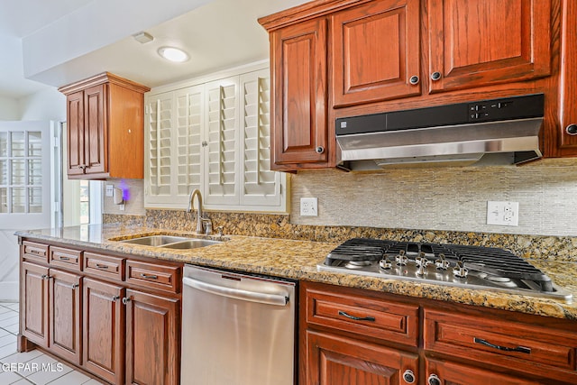 745 Rinconada Ln, El Paso, TX 79932 - kitchen with appliances with stainless steel finishes, under cabinet range hood, decorative backsplash, and light stone counters