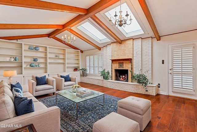 745 Rinconada Ln, El Paso, TX 79932 - living area with a chandelier, hardwood / wood-style floors, a skylight, and a brick fireplace