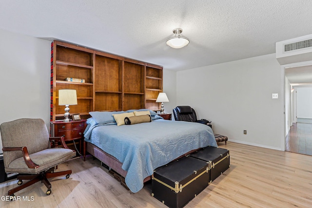 745 Rinconada Ln, El Paso, TX 79932 - bedroom featuring light wood finished floors and a textured ceiling