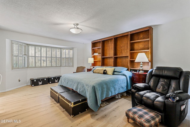 745 Rinconada Ln, El Paso, TX 79932 - bedroom with light wood finished floors and a textured ceiling