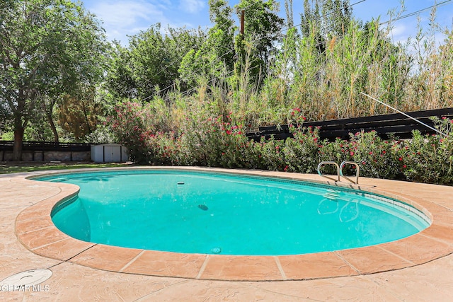 745 Rinconada Ln, El Paso, TX 79932 - view of pool with a storage unit and a patio