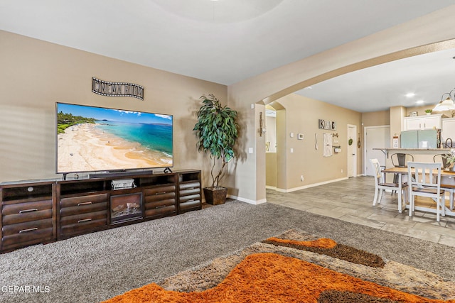 448 White Cloud Rd, El Paso, TX 79928 - living area with arched walkways and stone tile floors