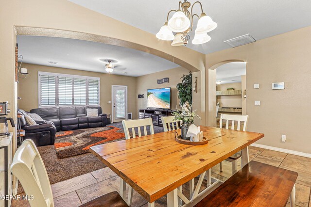 448 White Cloud Rd, El Paso, TX 79928 - dining room with arched walkways and a chandelier