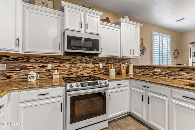 448 White Cloud Rd, El Paso, TX 79928 - kitchen featuring stainless steel appliances, white cabinetry, backsplash, stone counters, and wood finished floors