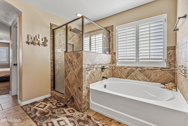 448 White Cloud Rd, El Paso, TX 79928 - bathroom featuring a garden tub, a stall shower, and ensuite bathroom