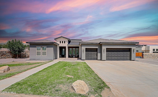 6328 Camino Nogal Dr, El Paso, TX 79932 - view of front of property with an attached garage, concrete driveway, stucco siding, a yard, and a tile roof
