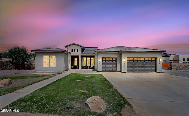 6328 Camino Nogal Dr, El Paso, TX 79932 - view of front of house with an attached garage, concrete driveway, stucco siding, and a lawn