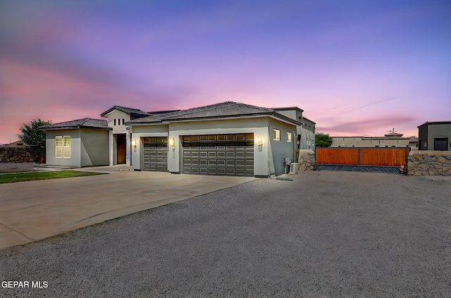 6328 Camino Nogal Dr, El Paso, TX 79932 - view of front facade with a garage, stucco siding, and concrete driveway