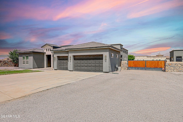 6328 Camino Nogal Dr, El Paso, TX 79932 - view of front of home with a garage, driveway, and stucco siding