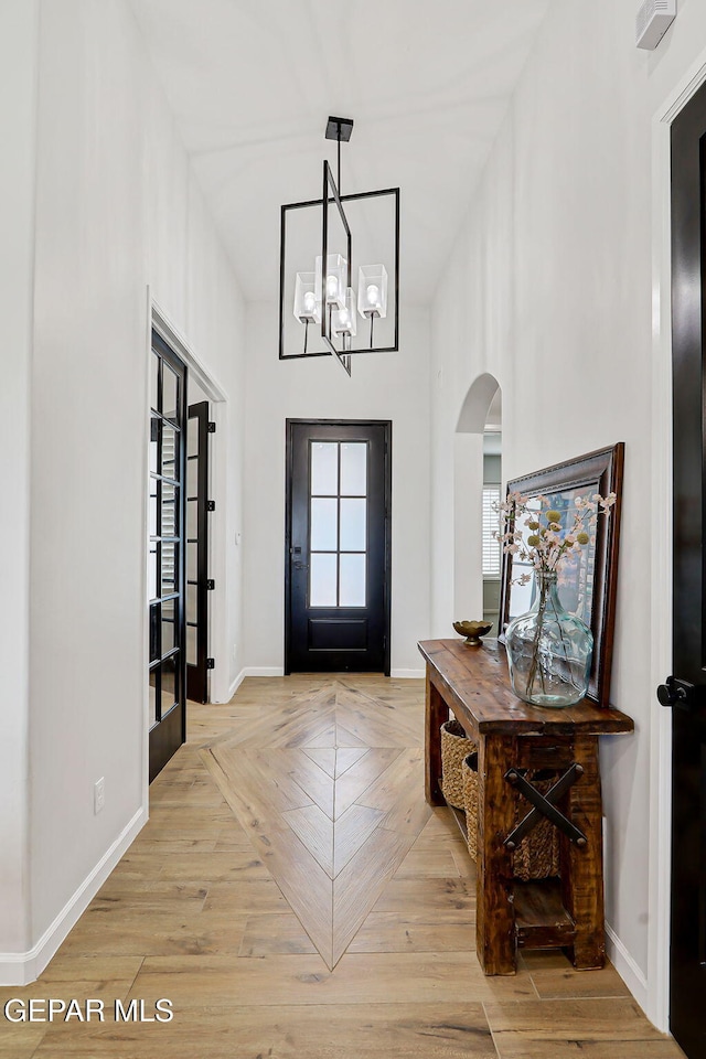6328 Camino Nogal Dr, El Paso, TX 79932 - entrance foyer featuring arched walkways and a chandelier