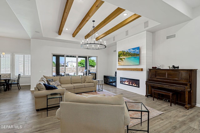 6328 Camino Nogal Dr, El Paso, TX 79932 - living room with light wood-style flooring, a fireplace, a chandelier, recessed lighting, and beam ceiling